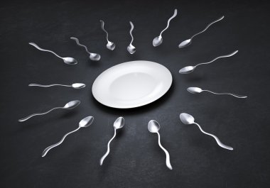 Sperm cell shaped spoons straggleing to get to an empty plate clipart