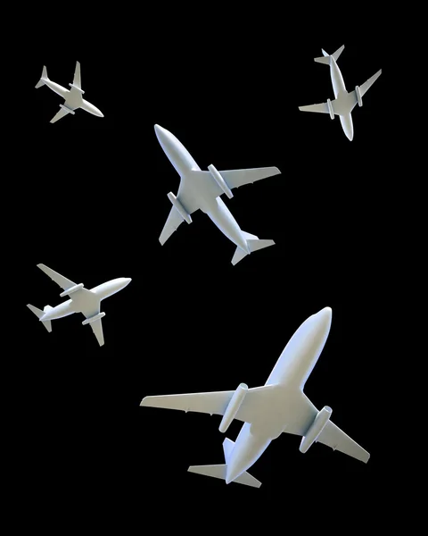 Five airplanes flying in different directions on a dark sky — Stock Photo, Image