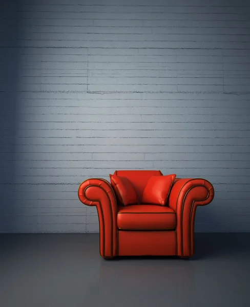 Czerwony skórzany fotel z betonową ścianą w tle. — Zdjęcie stockowe