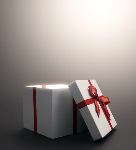 Λευκό δώρο με μια κόκκινη κορδέλα - εικόνα γιορτή Χριστουγέννων — Φωτογραφία Αρχείου
