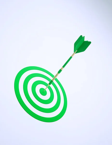 Soyut bir dart tahtası üzerinde yeşil bir ok — Stok fotoğraf