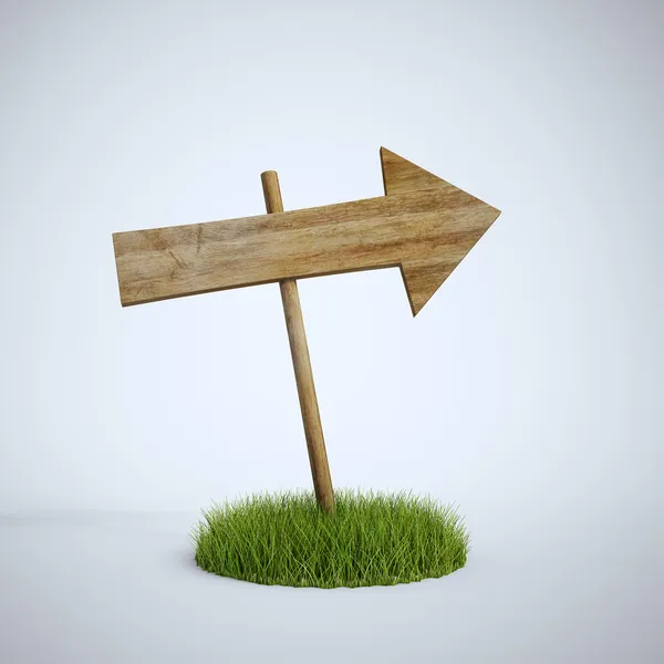 An empty arrow sign made out of wood on a patch of grass — Stock Photo, Image