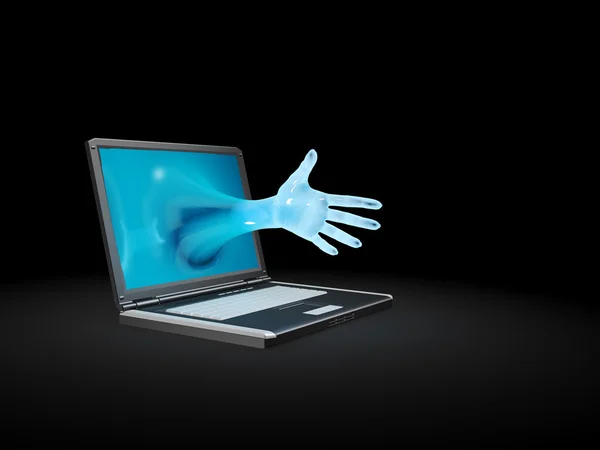 En hand når från en bärbar dator skärm — Stockfoto