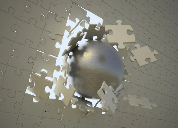 Stahlkugel durchbricht Oberfläche eines Puzzles — Stockfoto