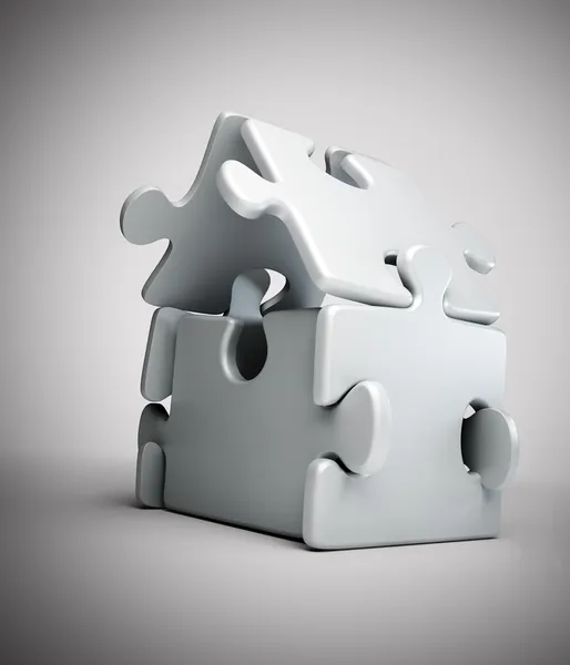 Símbolo da casa construído a partir de peças de puzzle — Fotografia de Stock