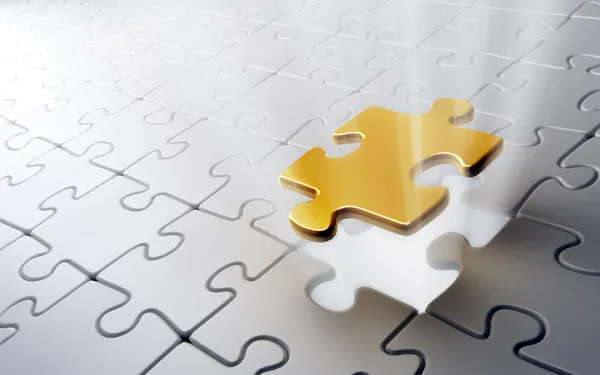 Jigsaw puzzle with a single golden piece — Stock Photo, Image