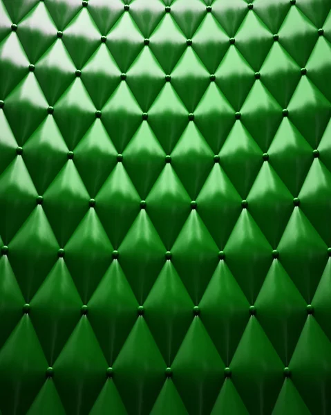 Zielona skórzana tapicerka z światło pochodzące z powyższych. — Zdjęcie stockowe