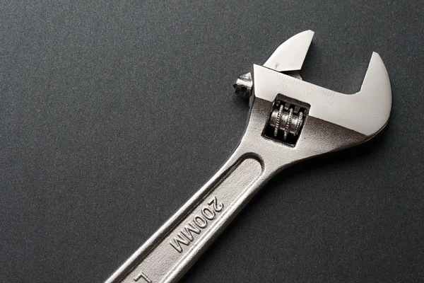 Spanner on a grey background — Stock Photo, Image