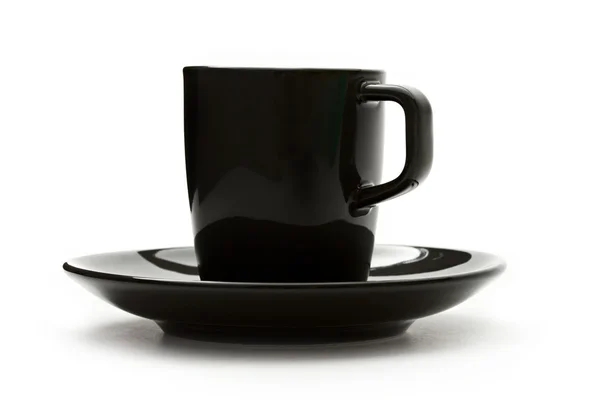 Ένα μαύρο σύνολο φλιτζάνι καφέ και πιατάκι — Φωτογραφία Αρχείου
