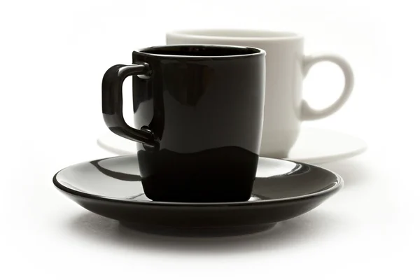 Una serie di tazze di caffè e piattini — Foto Stock