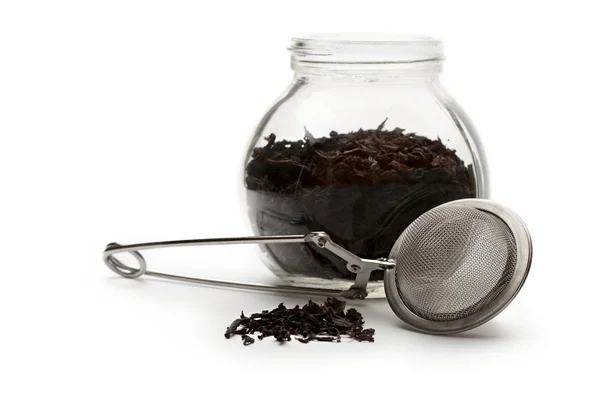 Glass container with tea — Stock Photo, Image