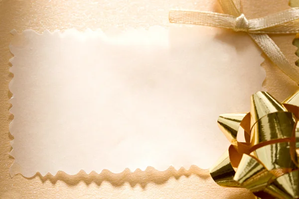 Une carte de vœux avec un arc — Photo