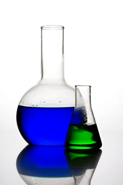 Glass flasks with liquid components — Stock Photo, Image
