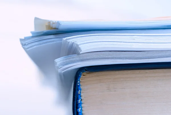 A pile of paper and a book — Stock Photo, Image