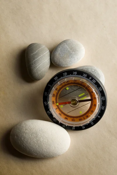 Stones and a compass — Stock Photo, Image
