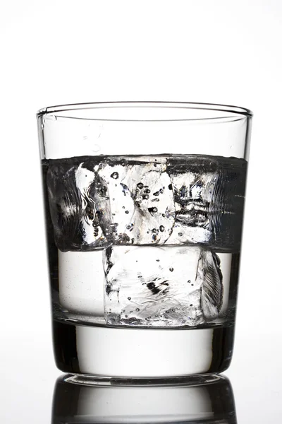Glass of water with ice cubes — Stock Photo, Image