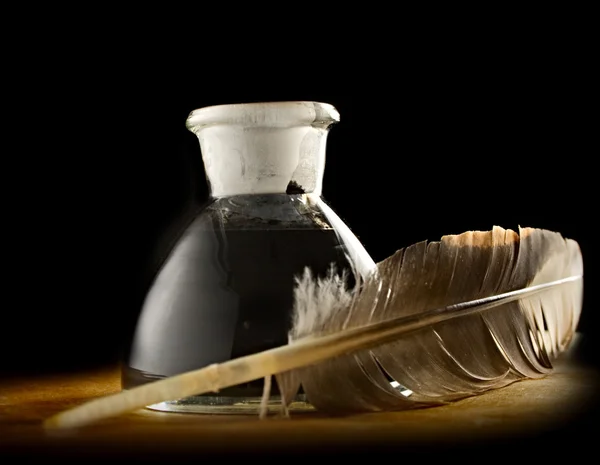 stock image A feather with the bottle full of ink