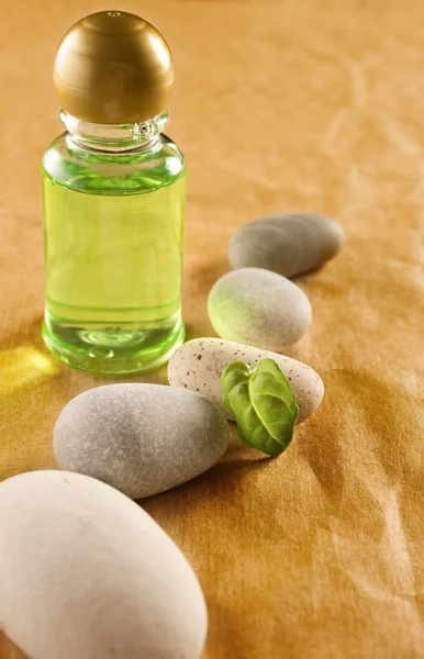 Shampoo bottle with stones — Stock Photo, Image