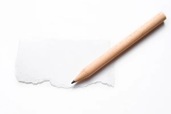 Crayon et un morceau de papier — Photo