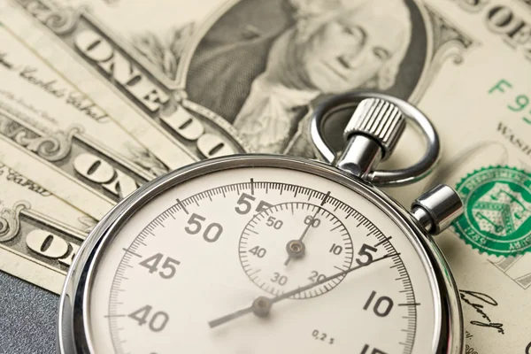 Stopwatch and dollars — Stock Photo, Image