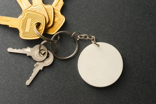 Keys on the grey background — Stock Photo, Image