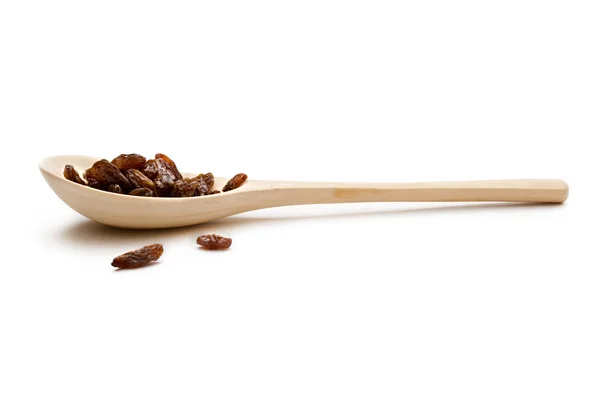 Raisins in a spoon — Stock Photo, Image