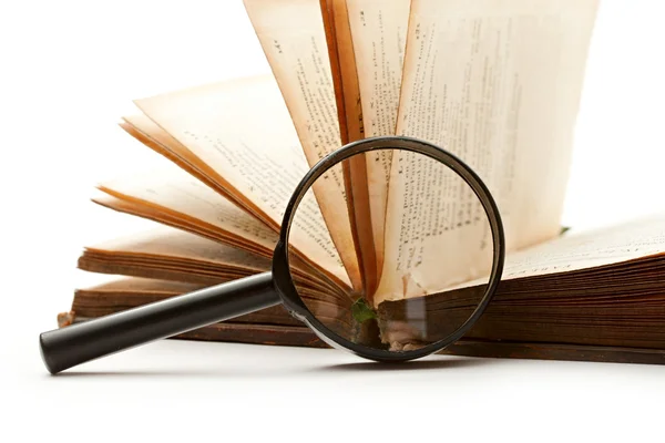 Magnifying glass and book — Stock Photo, Image