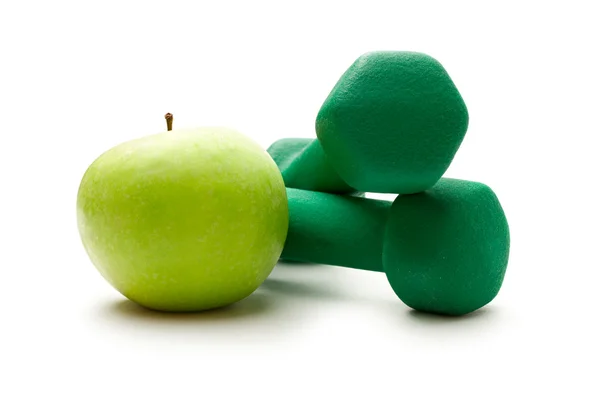 Dumbbells and an apple — Stock Photo, Image