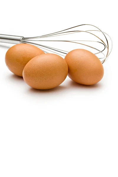Eggbeater and eggs — Stock Photo, Image