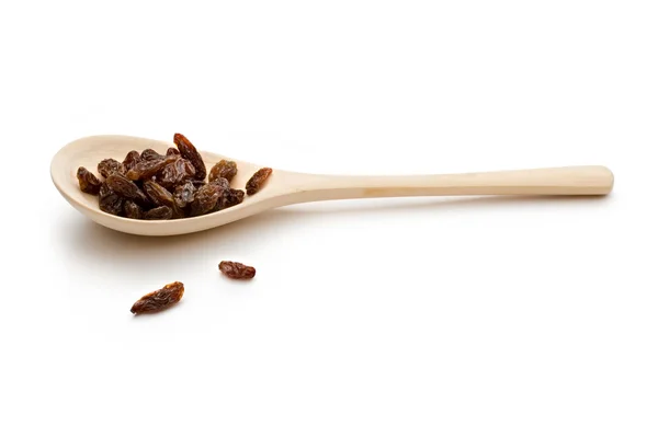 Raisins in a spoon — Stock Photo, Image