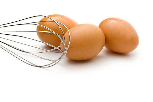 Eggbeater and eggs — Stock Photo, Image
