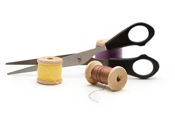 Thread bobbin and scissors — Stock Photo, Image