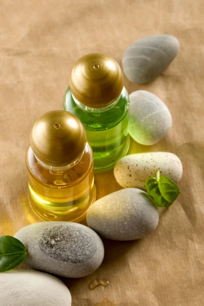 Shampoo bottles with stones — Stock Photo, Image
