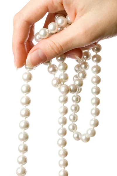Perla v ženské ruce — Stock fotografie