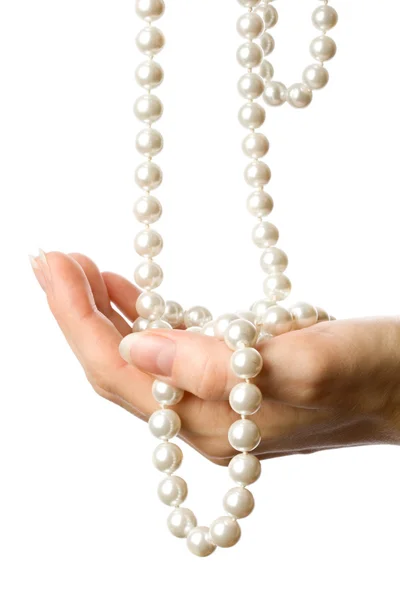Perla v ženské ruce — Stock fotografie