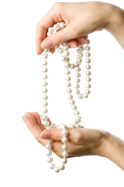 Pearl in woman 's hands — стоковое фото