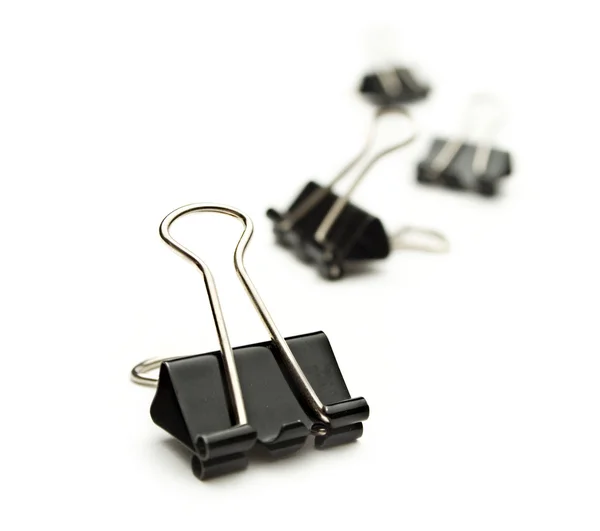 Black paper clips on white — Stock Photo, Image