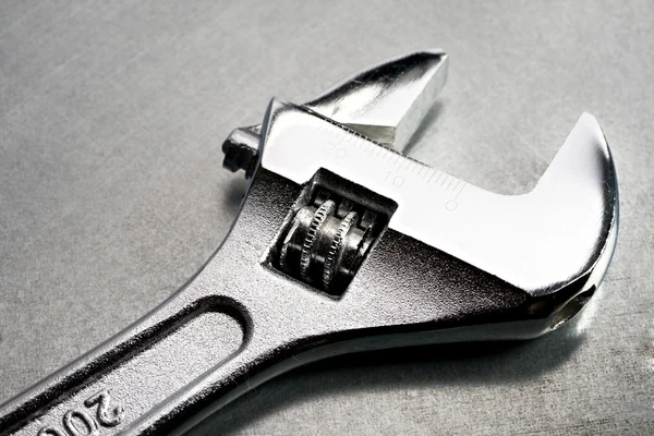 Spanner on the steel background — Stock Photo, Image