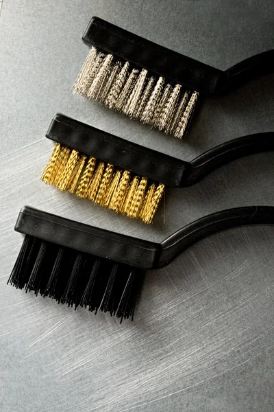 Escovas de metal no fundo de aço — Fotografia de Stock
