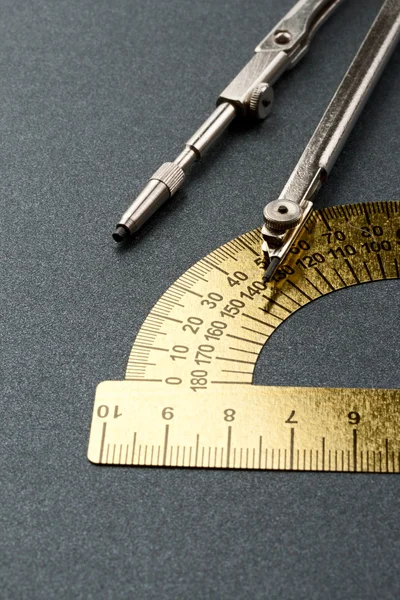 Pair of compasses and protractor — Stock Photo, Image