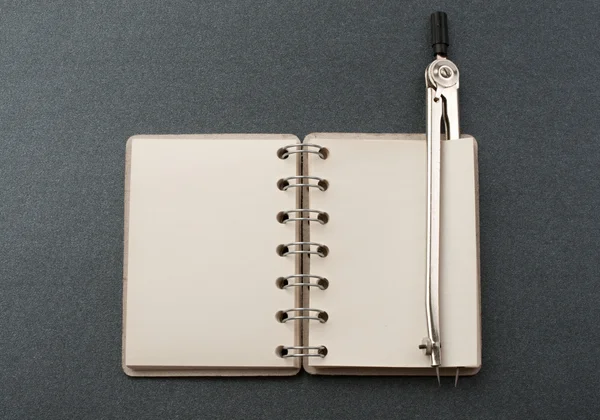 Notepad and compasses — Stock Photo, Image