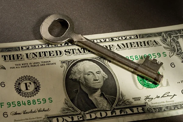 Dollar and key — Stock Photo, Image