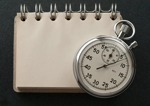 Notepad and stopwatch — Stock Photo, Image
