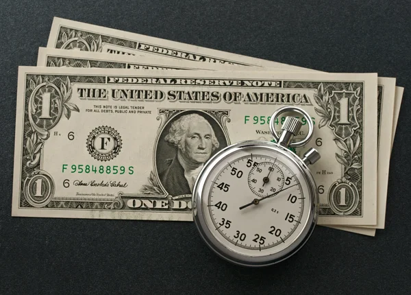 Kronometre ve dolar — Stok fotoğraf