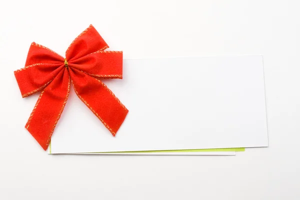 Red bow with card — Stock Photo, Image