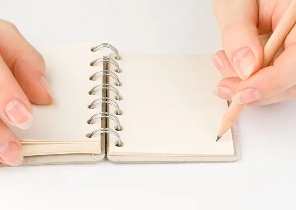 Hand and notepad — Stock Photo, Image
