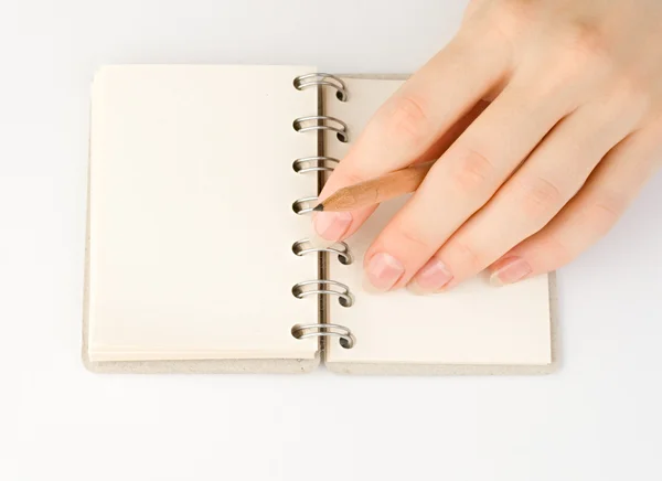 Hand and notepad — Stock Photo, Image
