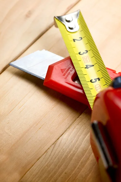 Tape measure and knife — Stock Photo, Image