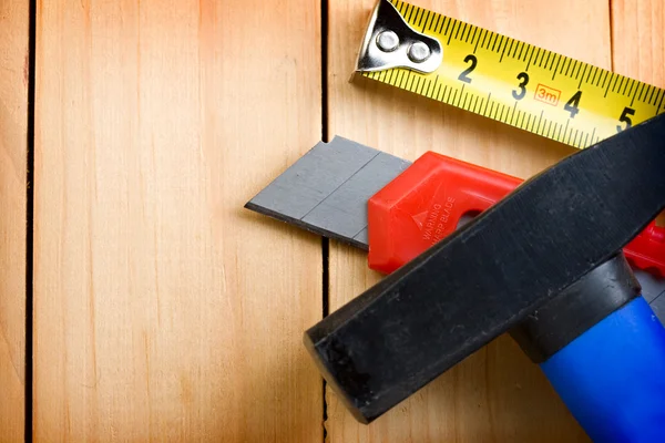 Tape measure, hammer and knife — Stock Photo, Image