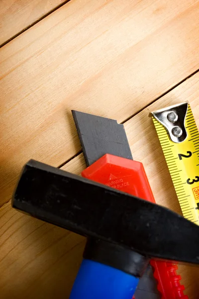 Tape measure, hammer and knife — Stock Photo, Image